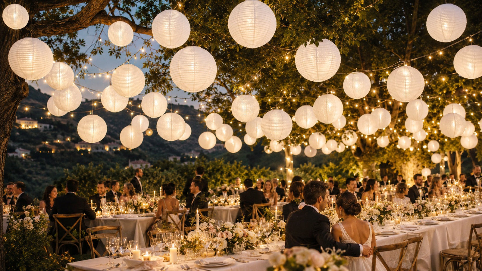 White nylon fine line lanterns hung in a backyard event setting
