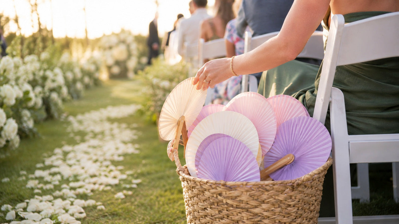 Colorful paper paddle hand fans arranged in a wedding palette of ivory, blush, turquoise and lavender