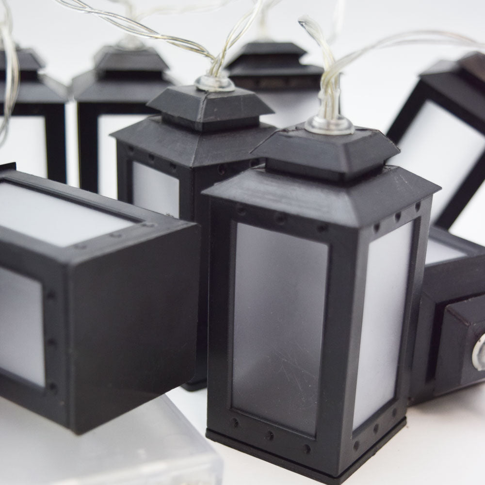 https://www.paperlanternstore.com/cdn/shop/products/led-candle-tea-light-lantern-string-light-decoration-battery-black-image-2.jpg?v=1585198924